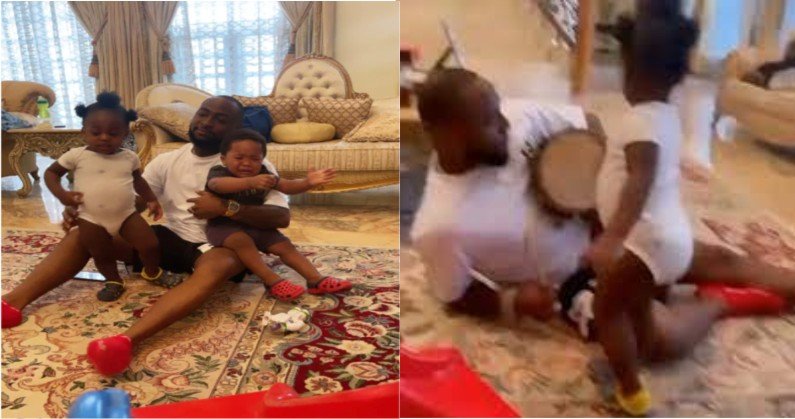 DADDY DUTIES: Davido Plays Talking Drum To Entertain Ifeanyi & B Red’s Son, Jordan, Has They Hang Out In His Father’s Mansion(VIDEO)