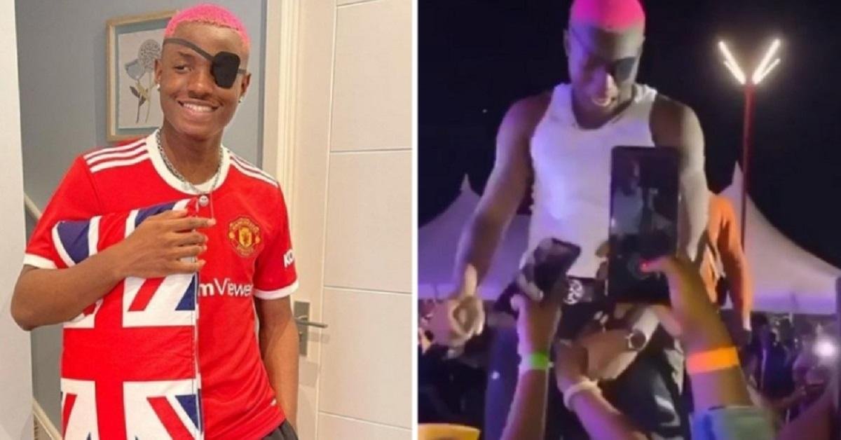 Shocking Moment a Lady Squeezed Nigerian Singer, Ruger’s Manhood on stage (Video)