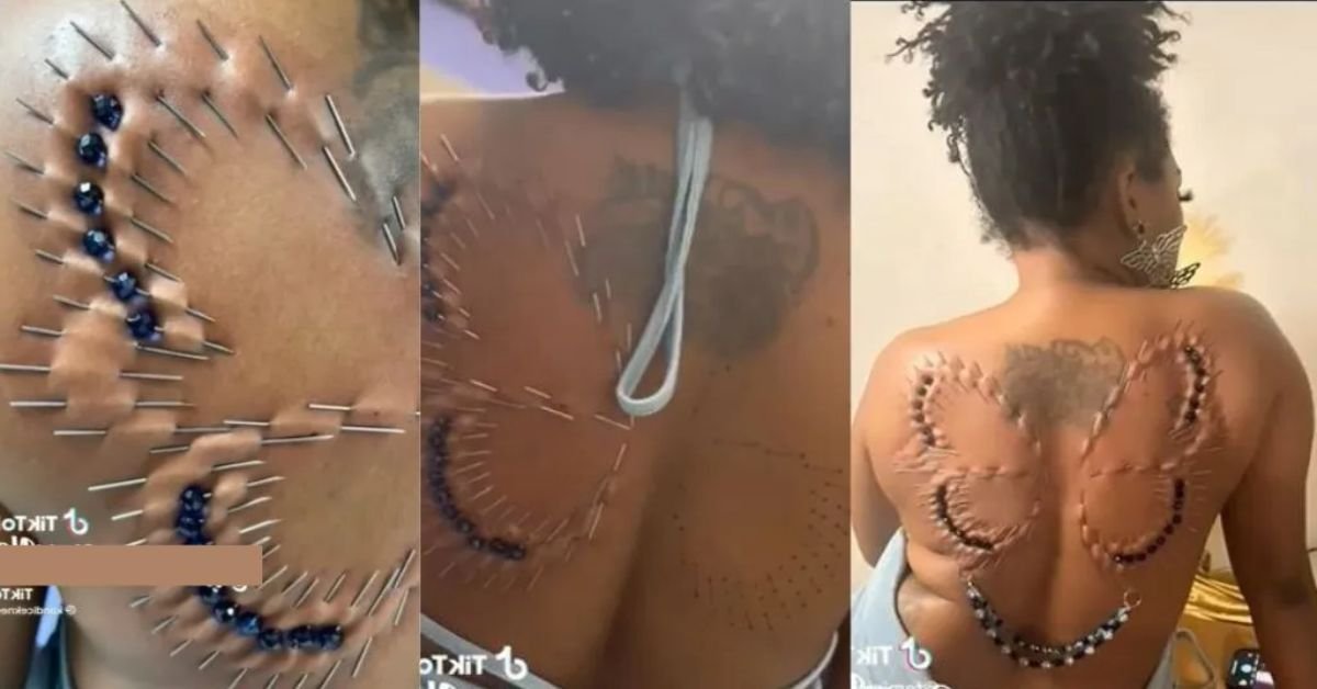 “This is madness” – Reactions as woman decorates her back using needle play to draw a big butterfly on it (Video)