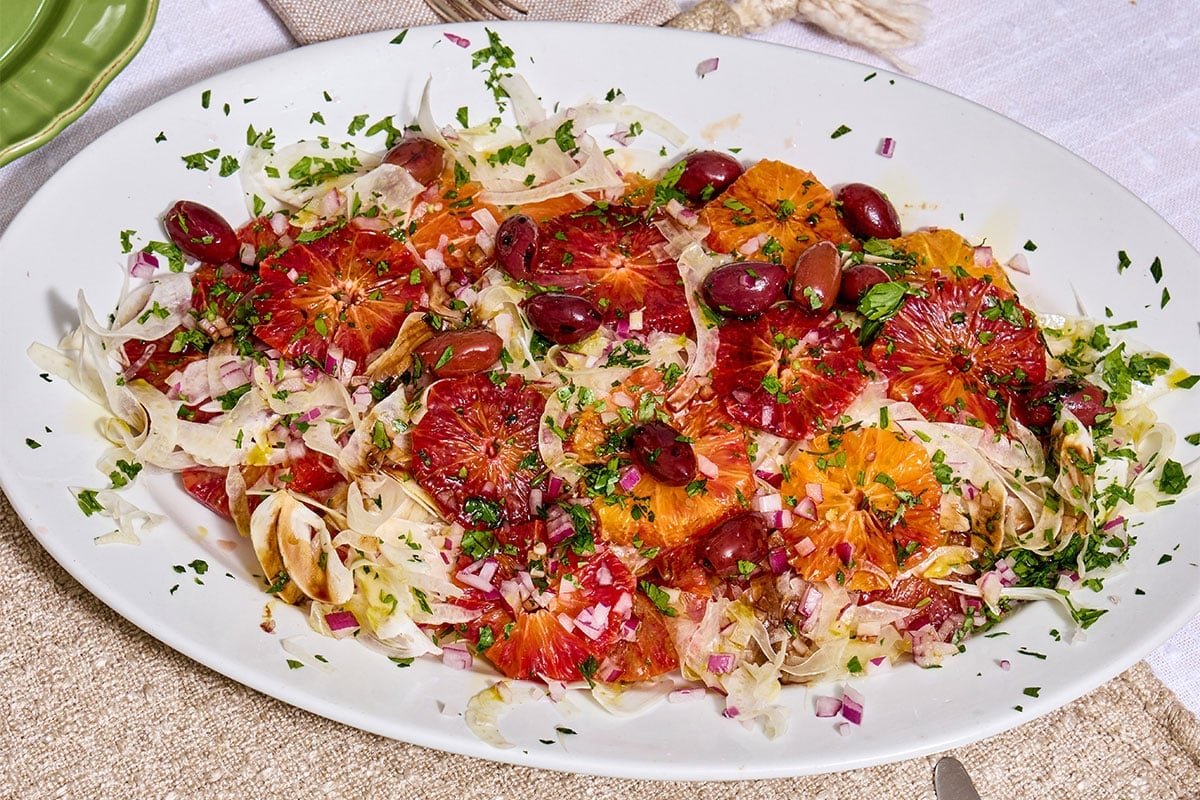 Sicilian orange salad on platter with fennel and parsley.